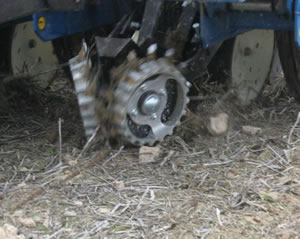 Clods ahead of Kinze planter unit